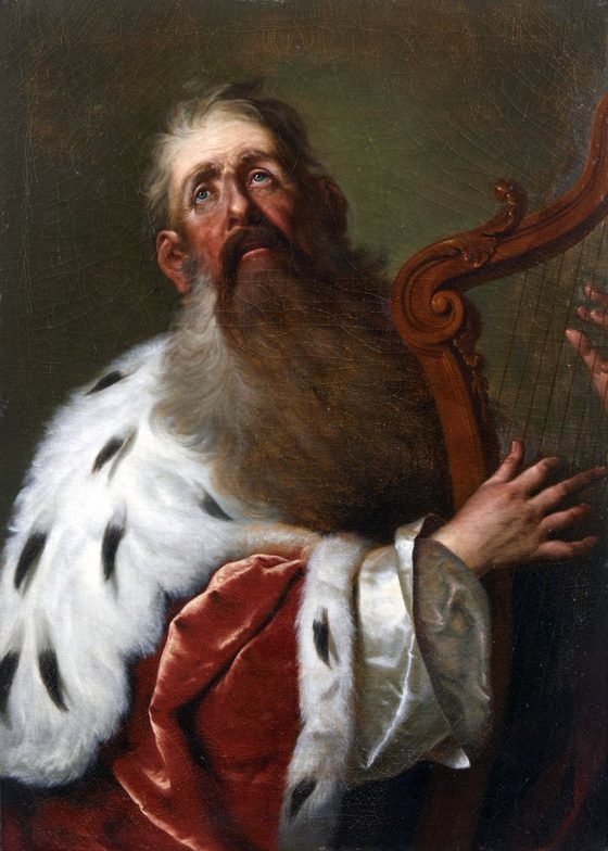 King David, an old man with a long beard and an ermine cape, looks up to heaven as he plays the harp