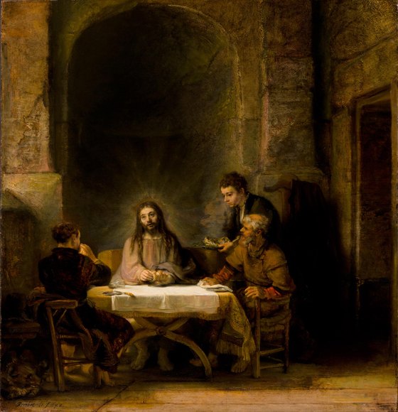 Christ, with light around His head, breaks bread at a table with two travelers who have just recognized Him, while a young servant brings a dish