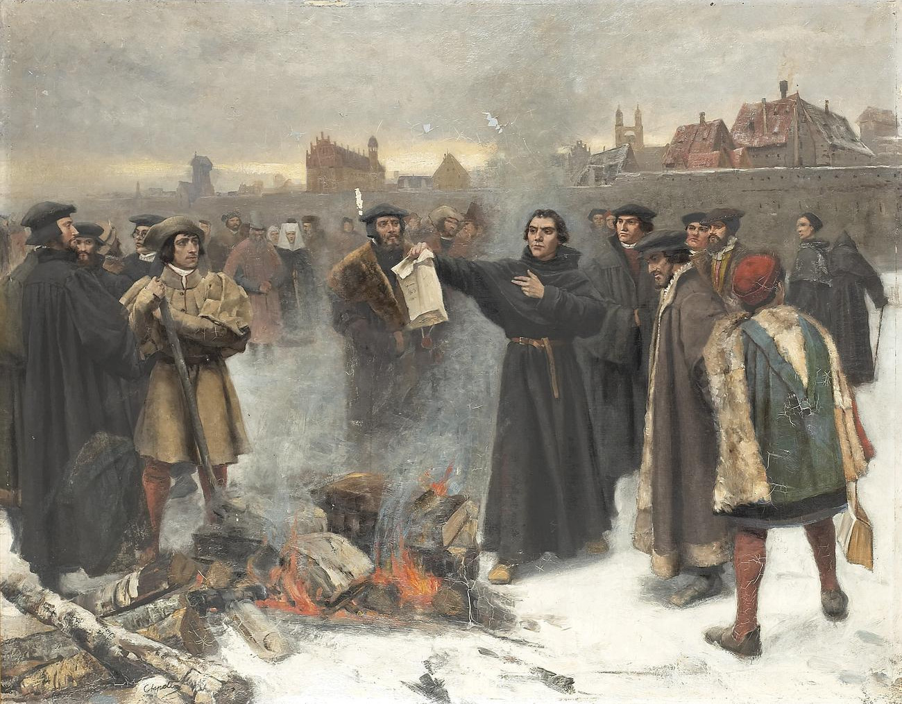 Luther holds a document over a bonfire in a snowy town square while a crowd watches