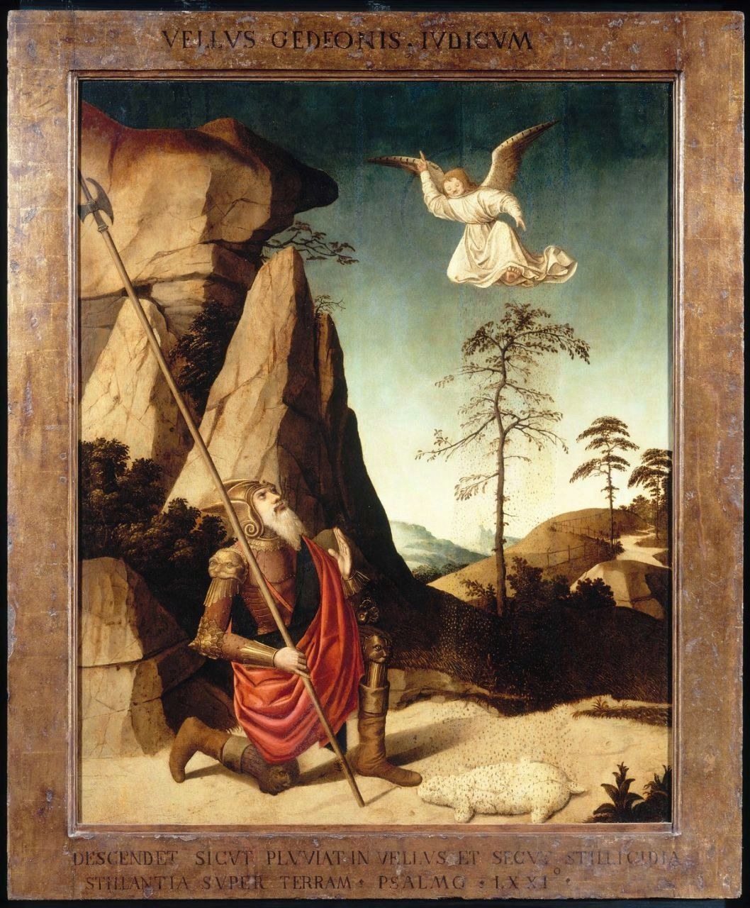 A painting in a wooden frame: Gideon, grey-bearded, in armour and a red cloak, kneels on rocky ground holding a halberd and looks up at a white-robed angel flying in the sky. A fleece lies on the ground beside him. Tall rocks and thin pine trees stand behind. Latin words run along the top and the foot of the frame.