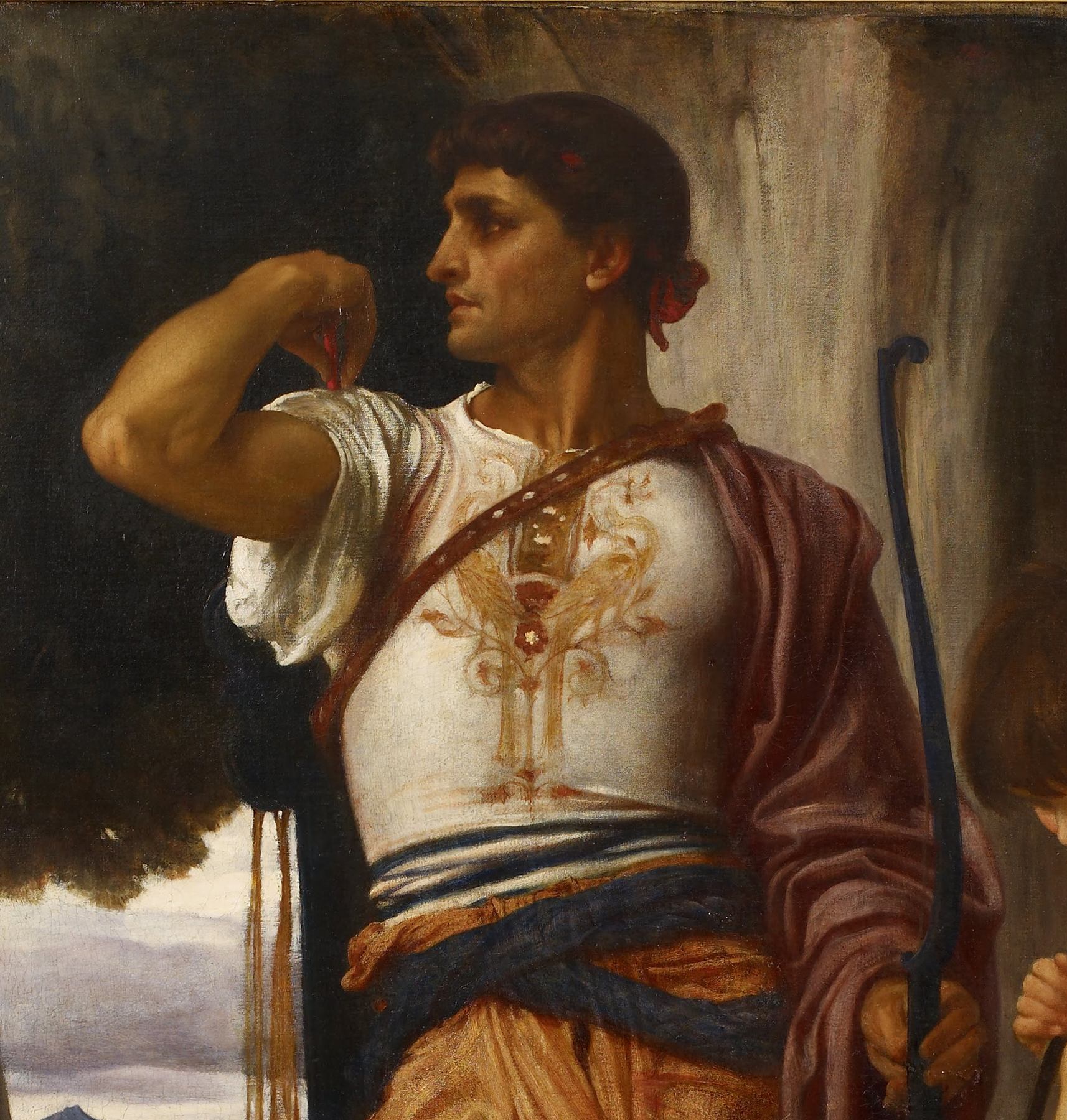 A painting by Frederic Leighton: Jonathan, a dark-haired man with a strong profile, looks away to the right. He wears a white tunic embroidered in gold, a blue and orange sash, and a dark red cloak over one shoulder. One hand is raised to his shoulder. A tall bow stands at his side. Behind him are dark trees, a grey sky and the trunk of a great tree.