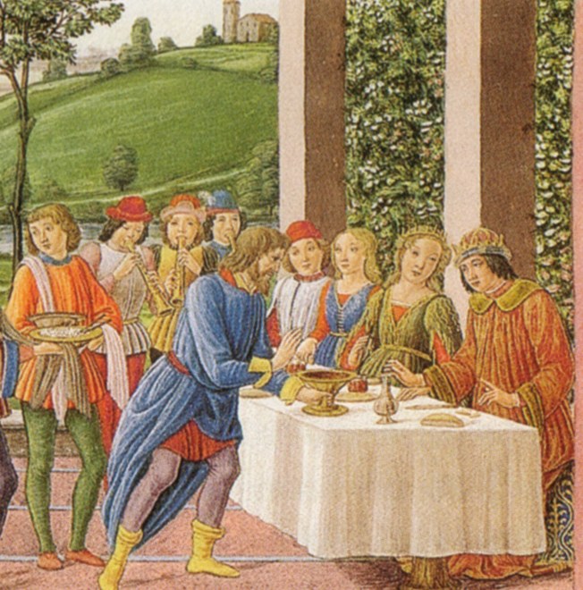 A Renaissance painting on a Bible page: under a loggia, a bearded man in a long blue robe bows and holds out a gold cup to a young king in red with a gold crown, seated at a table laid with a white cloth. A crowned queen sits beside the king. Musicians and servants stand behind, with green hills beyond the columns.
