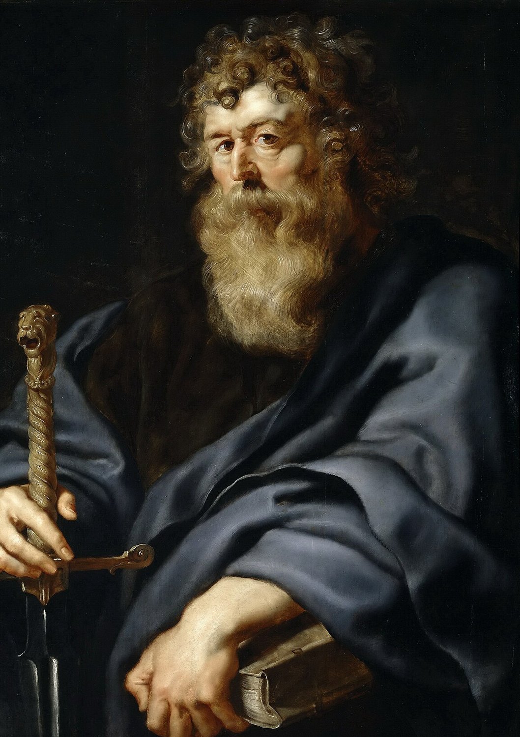A painting by Rubens: Paul, an old man with thick grey-brown curls and a long full beard, glances to the left. He wears a deep blue cloak over a dark robe. One hand grips a sword by its carved hilt, and the other rests on a closed book.