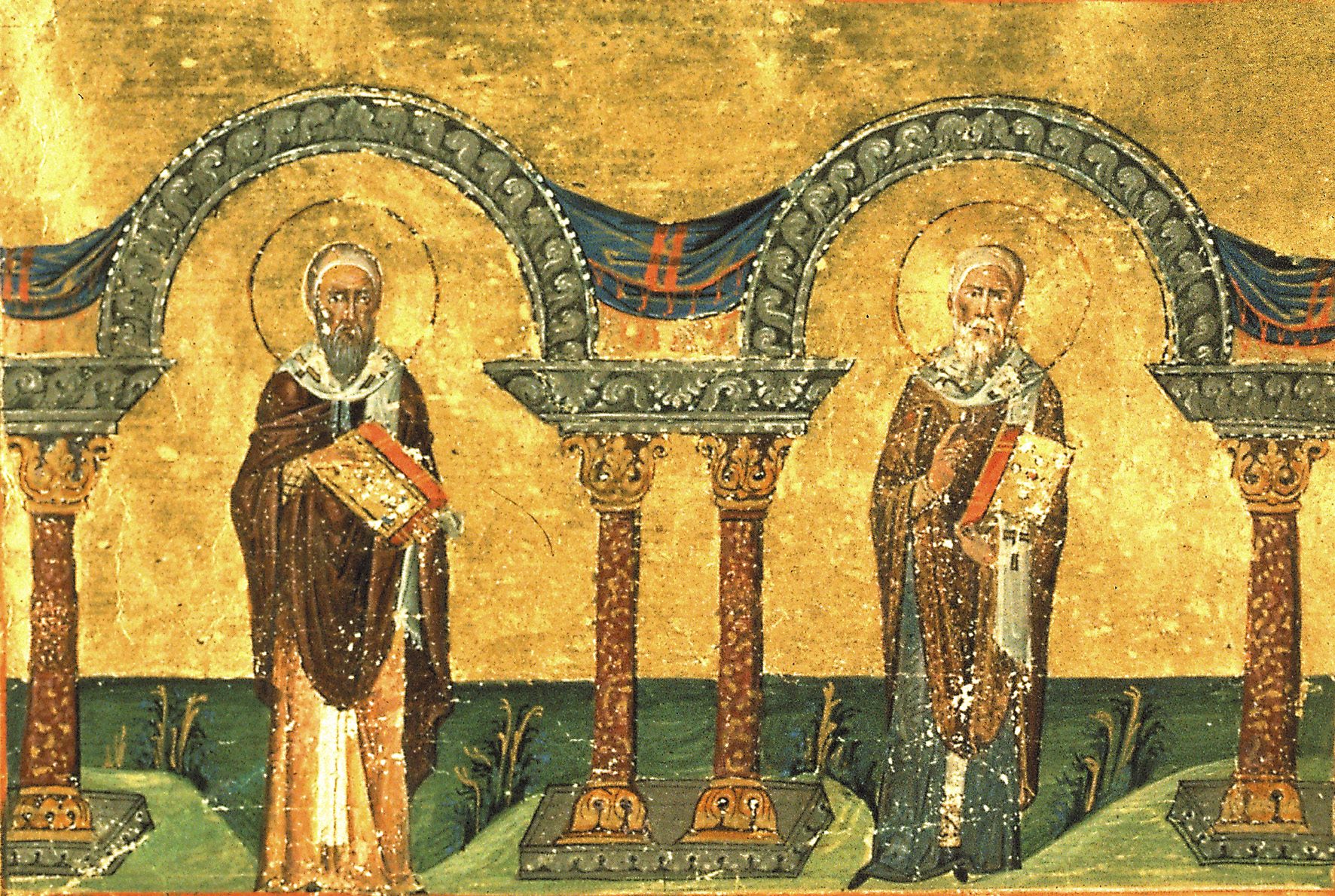 A Byzantine miniature on gold: two bishops in brown and blue robes, each holding a jewelled book, stand under two green arches on columns, above a strip of green ground