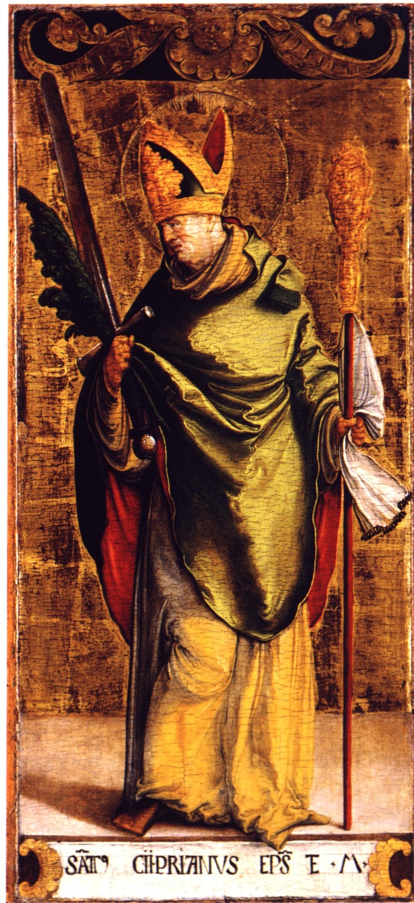 Saint Cyprian as a bishop in a gold mitre and green cloak, holding a sword and a martyr's palm, with his name painted on a panel below