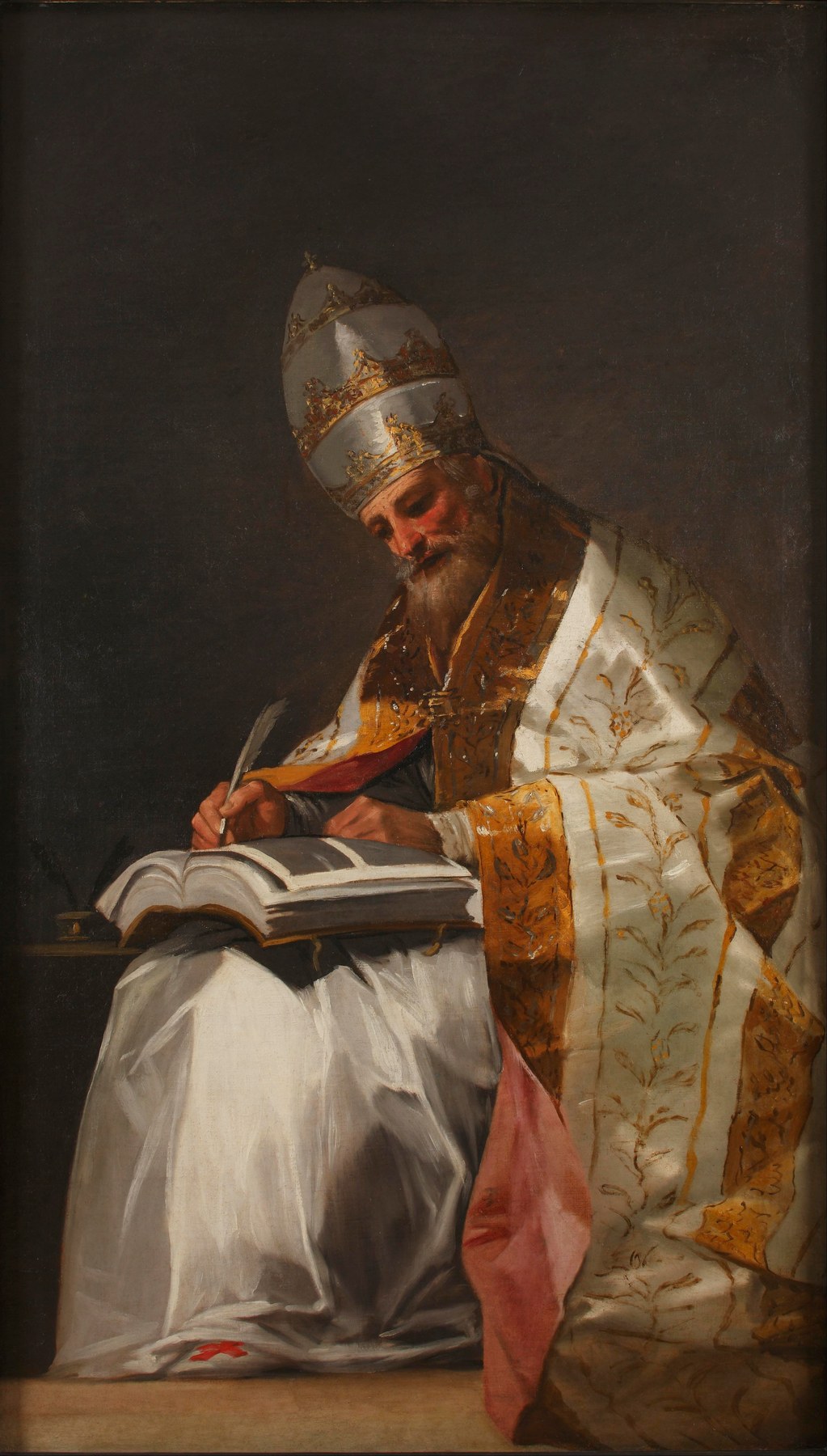 Gregory the Great, an old bearded pope in a silver three-tiered crown and a white and gold cope, sits writing in a large book with a quill against a dark background