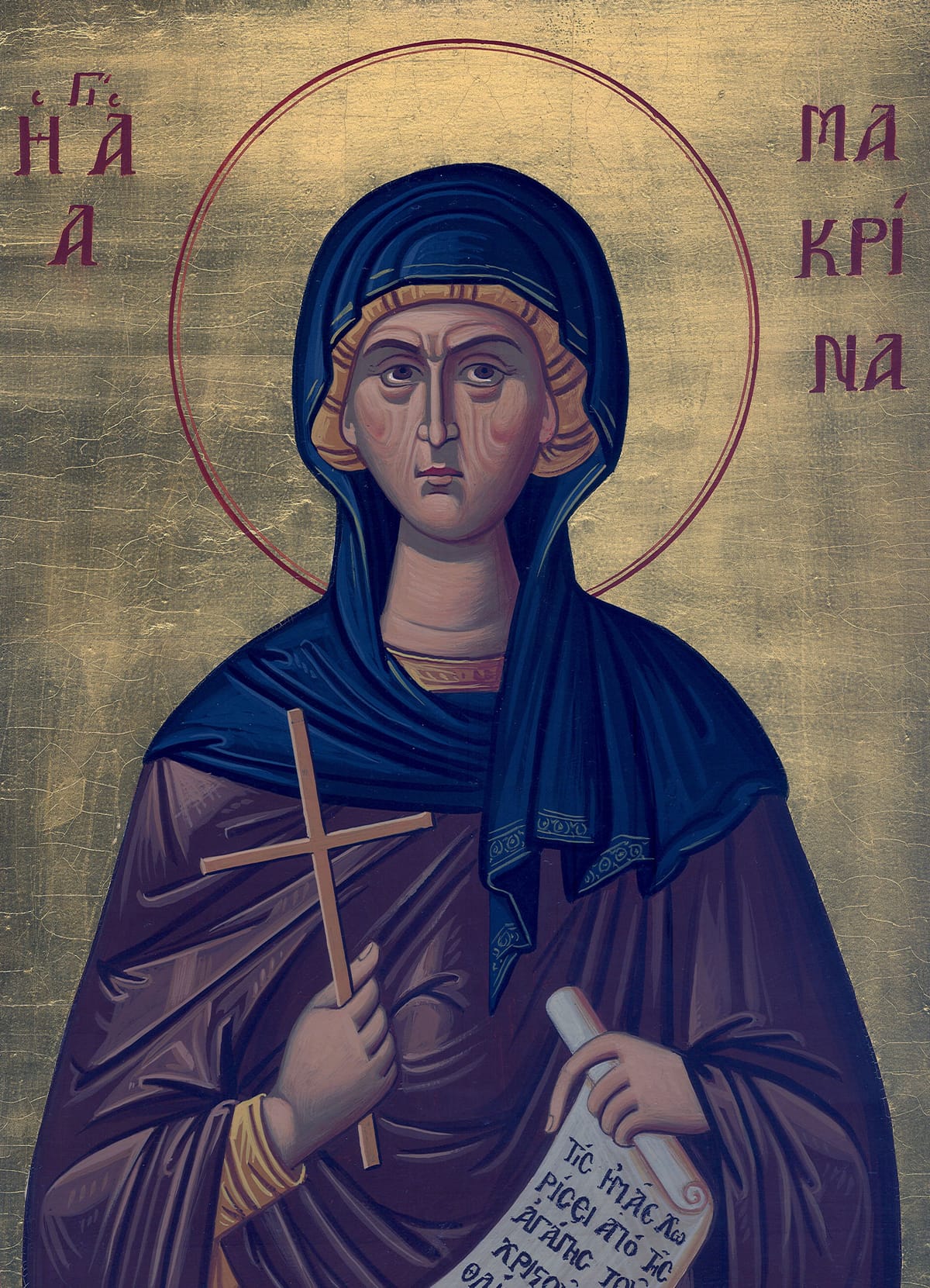 An icon of Saint Macrina in the Byzantine style: a woman with a stern, steady face in a dark blue veil and a purple habit, a thin red halo on a gold ground. She holds a cross in her right hand and an open scroll with Greek writing in her left, and her name is written in Greek on either side of her head.