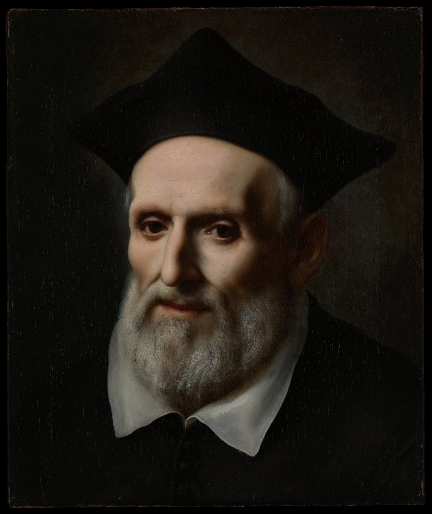 Philip Neri in old age, with a white beard, a black priest’s cap and a white collar